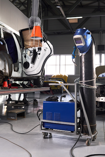 Champion Air Compressors used in an industrial workshop environment to support welding and compressed air operations