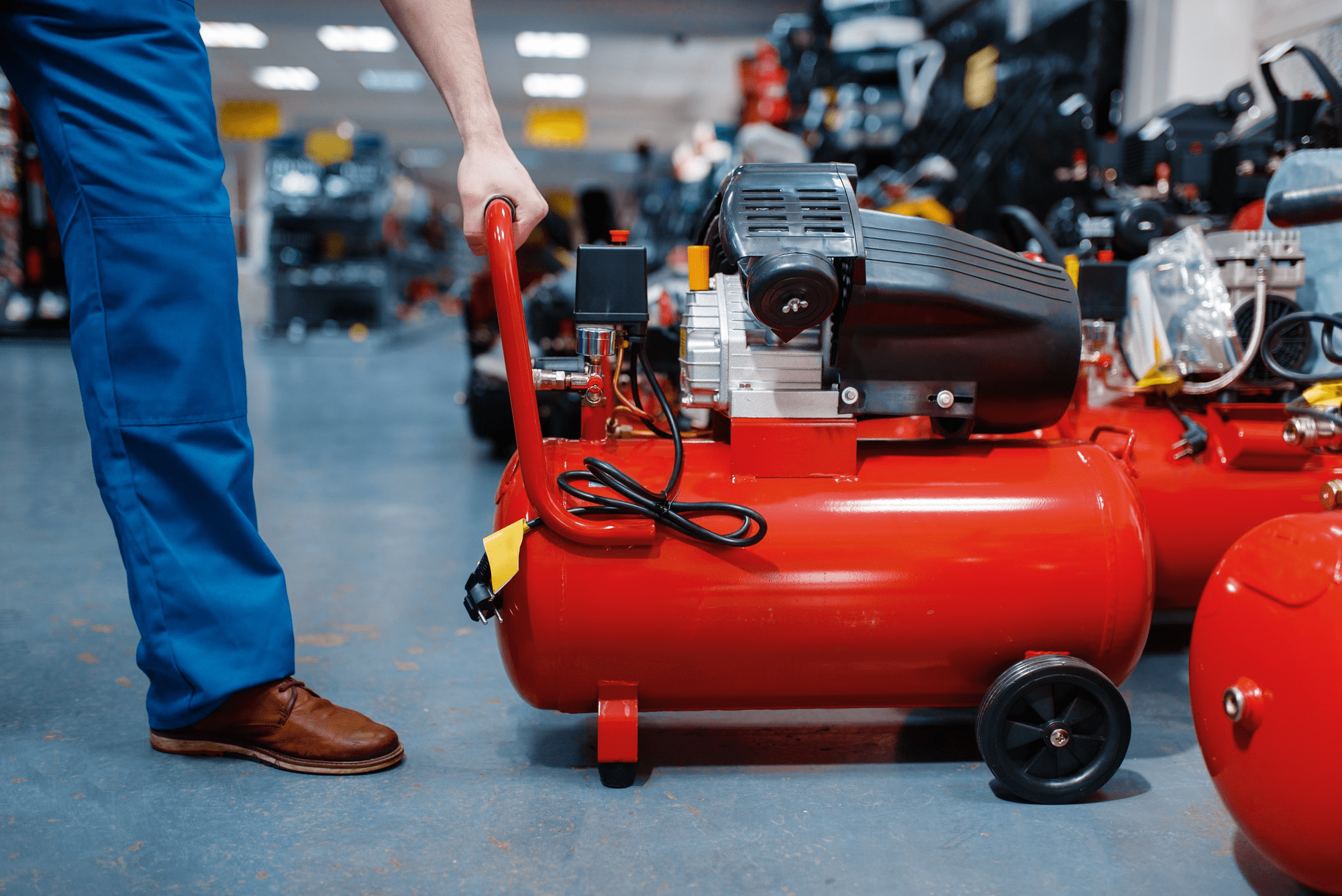 diesel air compressor buying guide Portable industrial air compressor with wheels displayed in a workshop, used in a diesel air compressor buying guide